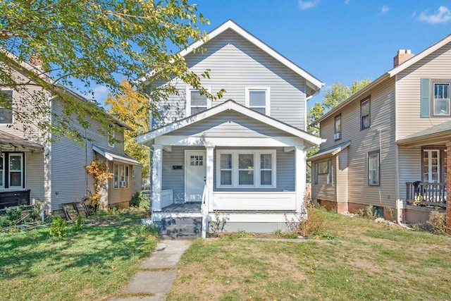 view of front of home featuring a porch and a front yard