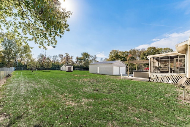 view of yard with a sunroom and a shed