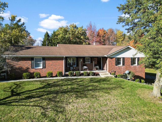 single story home featuring a front lawn