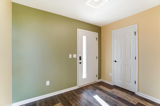 foyer with dark hardwood / wood-style flooring