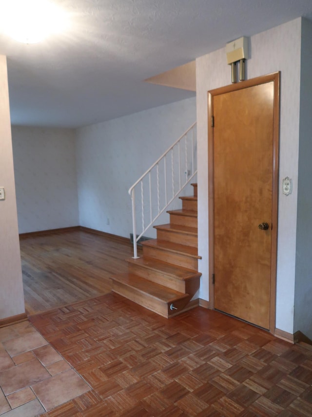 stairs with parquet floors