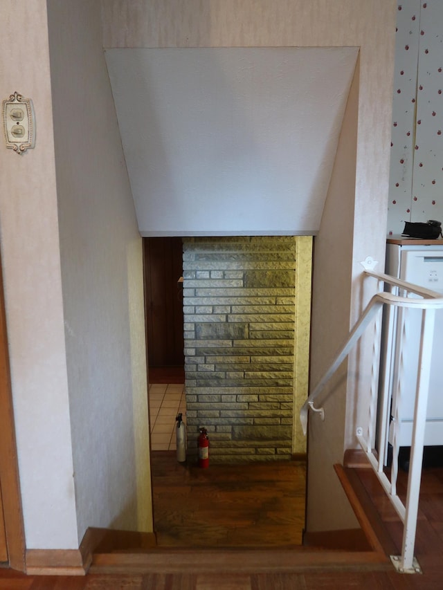 stairs with hardwood / wood-style flooring