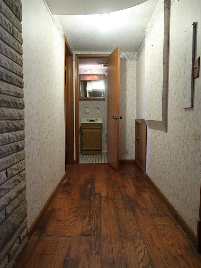 corridor featuring dark hardwood / wood-style flooring