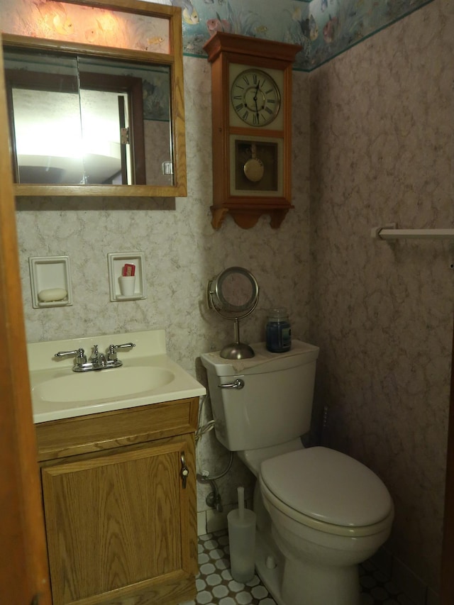 bathroom featuring vanity and toilet