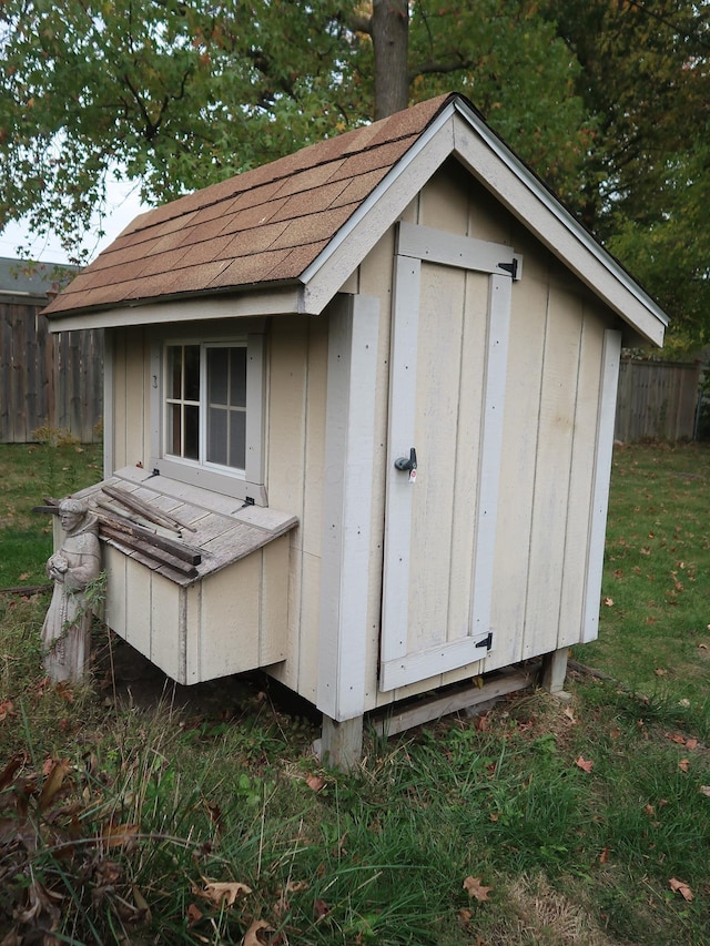 view of outbuilding featuring a lawn