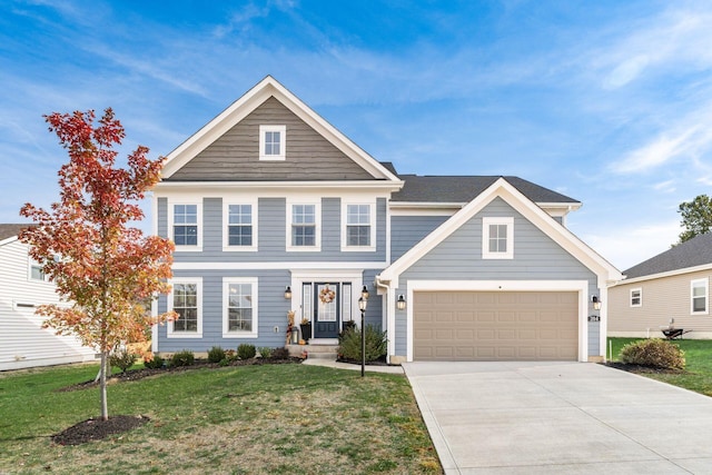 view of front of property with a front lawn and a garage