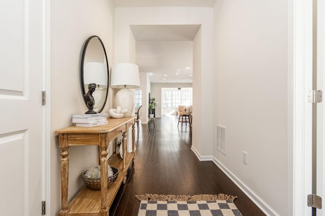 corridor with dark wood-type flooring