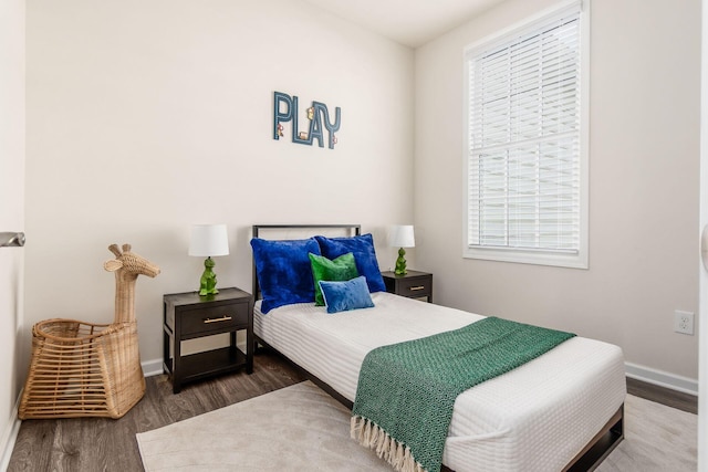 bedroom featuring dark hardwood / wood-style flooring