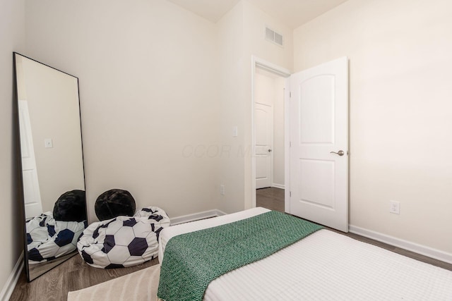 bedroom featuring hardwood / wood-style flooring