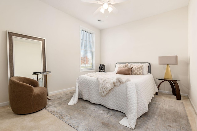 bedroom featuring light colored carpet and ceiling fan