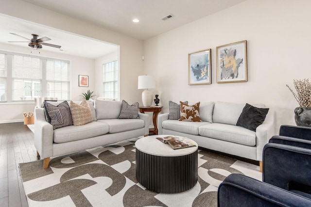 living room with ceiling fan and hardwood / wood-style floors