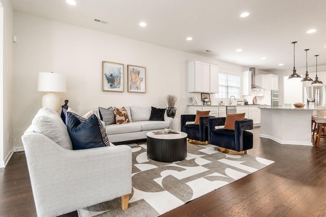 living room featuring dark hardwood / wood-style floors