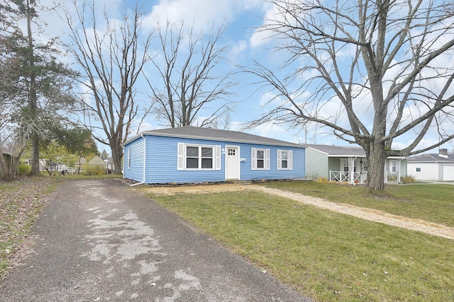 view of front of property with a porch and a front yard