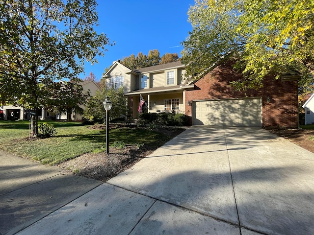 view of front property featuring a garage, covered porch, and a front yard