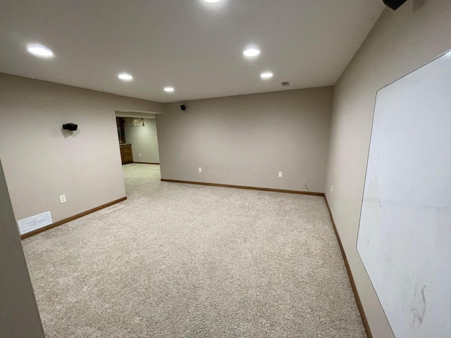 unfurnished room featuring carpet floors