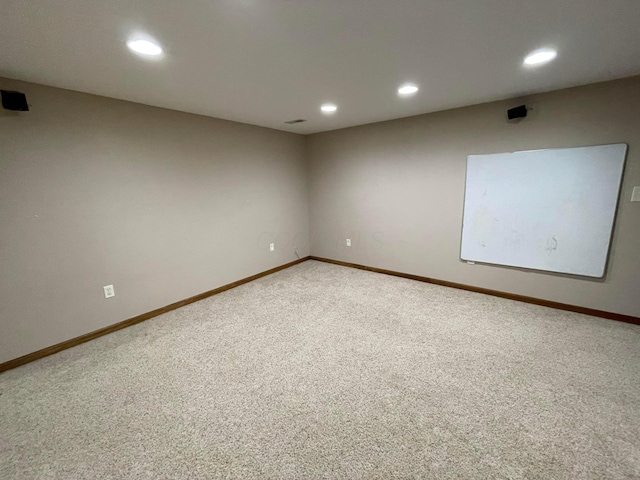 empty room with carpet flooring