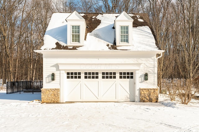 view of snow covered garage