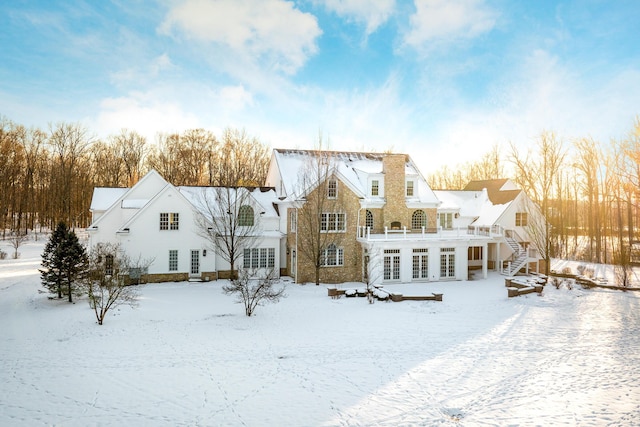 view of snow covered house