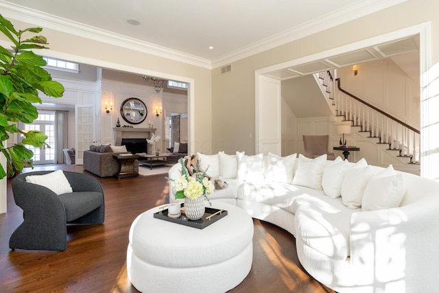 living room with crown molding and dark hardwood / wood-style floors