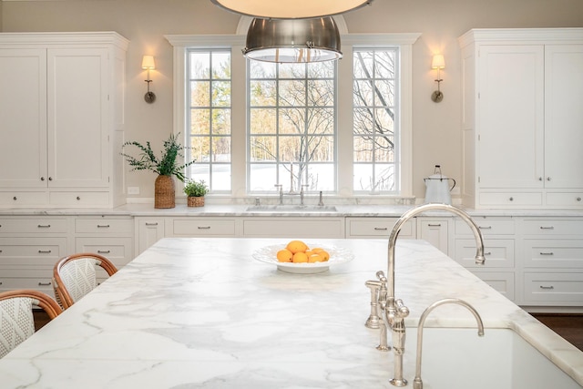 dining room featuring sink and plenty of natural light