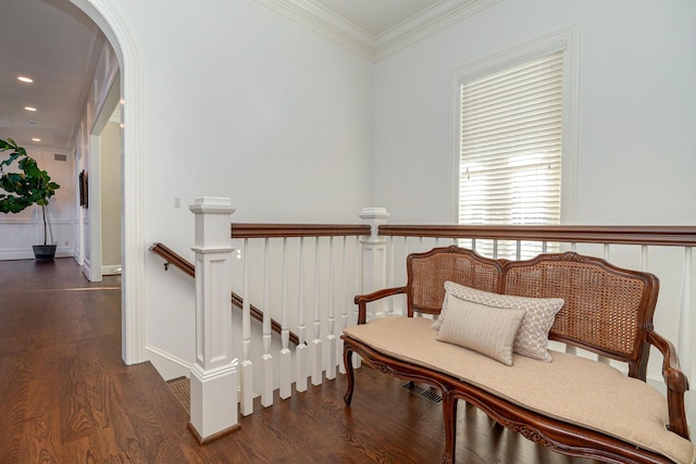 living area with dark hardwood / wood-style floors and ornamental molding