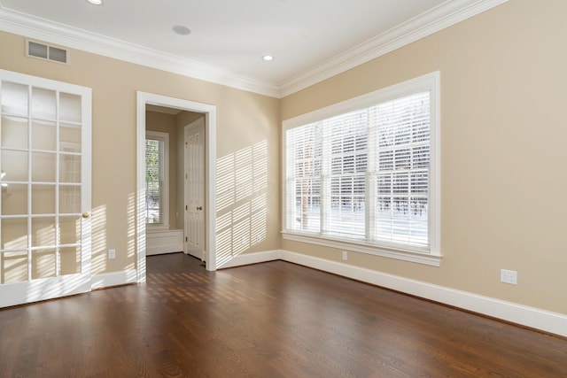 spare room featuring crown molding and dark wood-type flooring