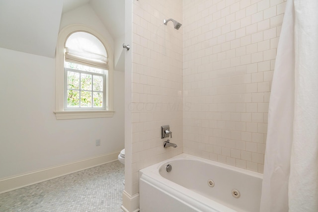 bathroom with toilet, lofted ceiling, shower / bathtub combination with curtain, and tile patterned flooring