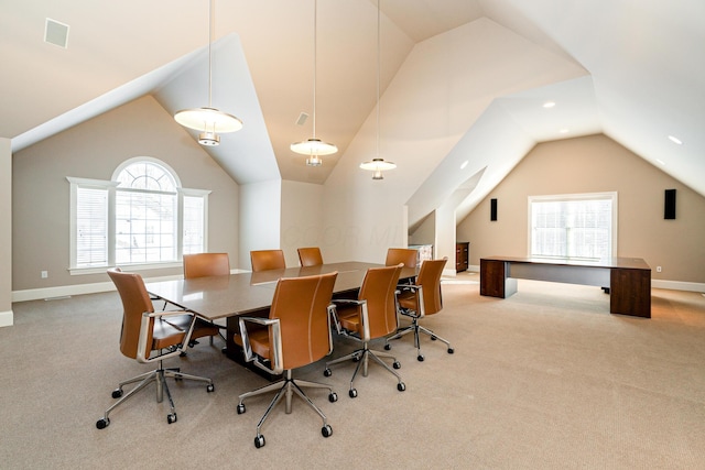 dining space featuring light carpet