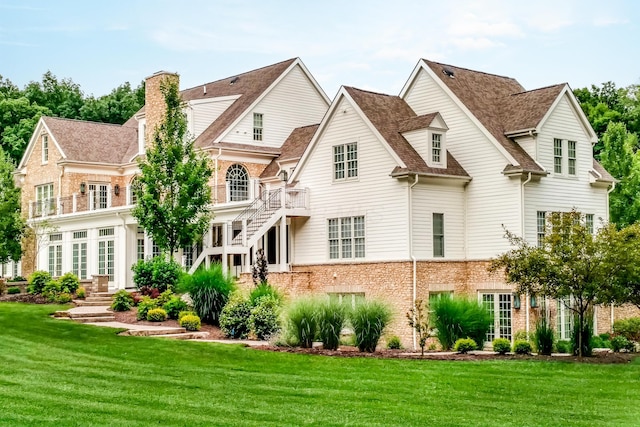 rear view of house with a lawn