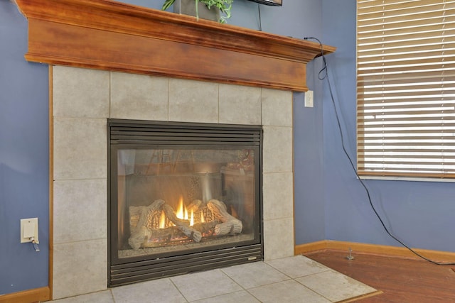 interior details with a tiled fireplace