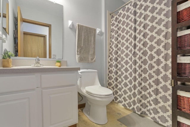 bathroom with tile patterned flooring, vanity, and toilet