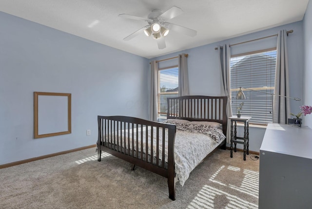 bedroom with ceiling fan and carpet floors