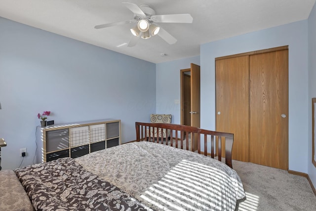 bedroom featuring ceiling fan, a closet, and carpet floors