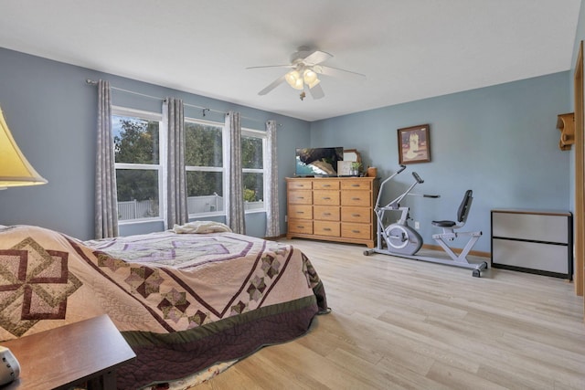 bedroom featuring ceiling fan and light hardwood / wood-style floors