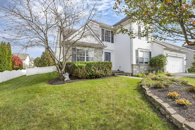 view of front of home featuring a garage and a front lawn