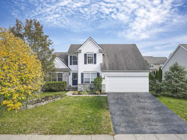 front of property featuring a garage and a front lawn