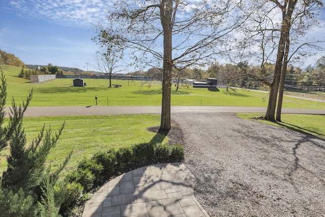 view of property's community with a yard