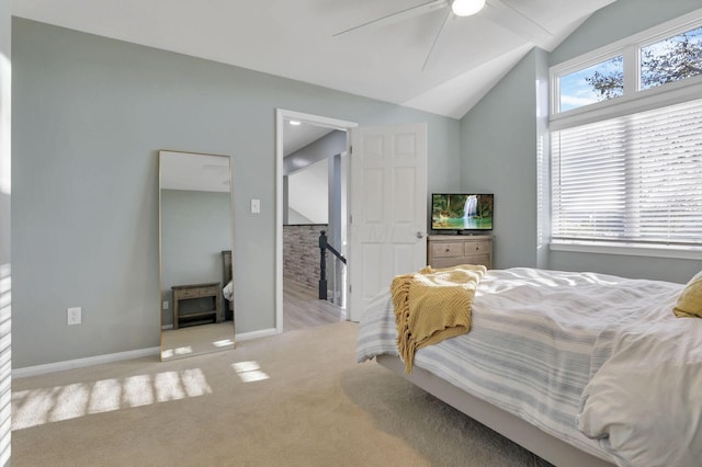 carpeted bedroom featuring ceiling fan and lofted ceiling