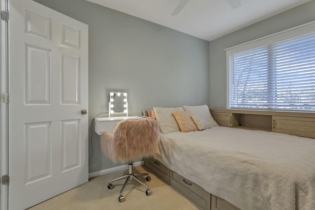 carpeted bedroom featuring ceiling fan