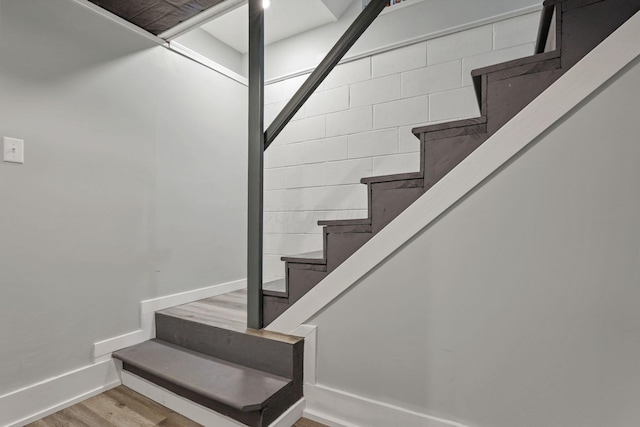 stairs with hardwood / wood-style floors