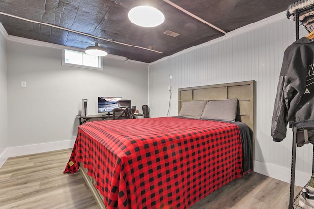 bedroom with wood-type flooring