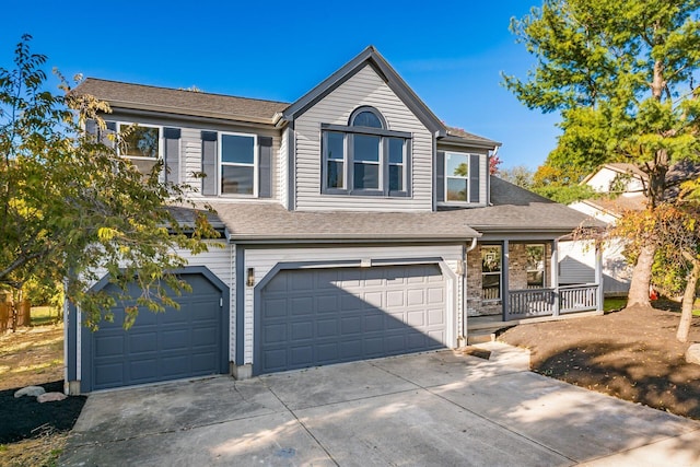 view of front of home with a porch and a garage