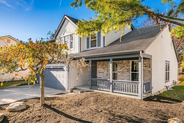 view of front of house featuring a garage and covered porch