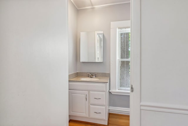 bathroom with vanity and hardwood / wood-style flooring