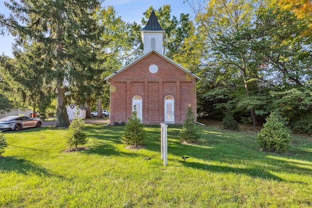 exterior space with a front lawn