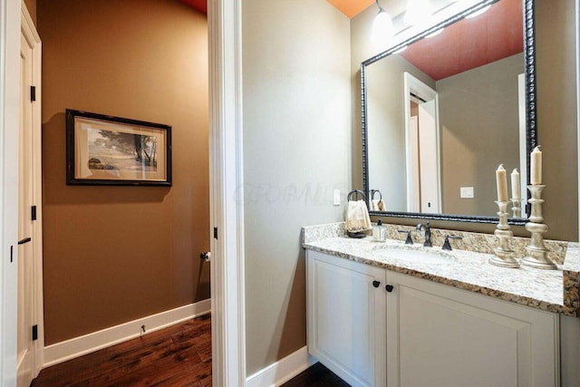 bathroom featuring hardwood / wood-style floors and vanity