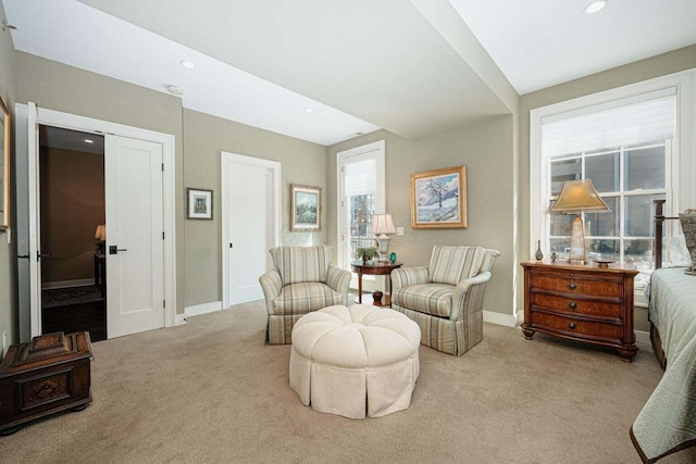 sitting room featuring light colored carpet