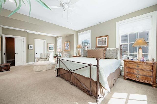 bedroom featuring ceiling fan and light carpet