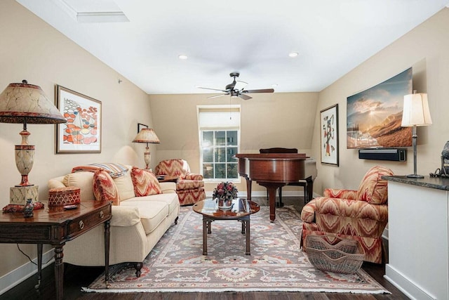 living room featuring hardwood / wood-style floors and ceiling fan