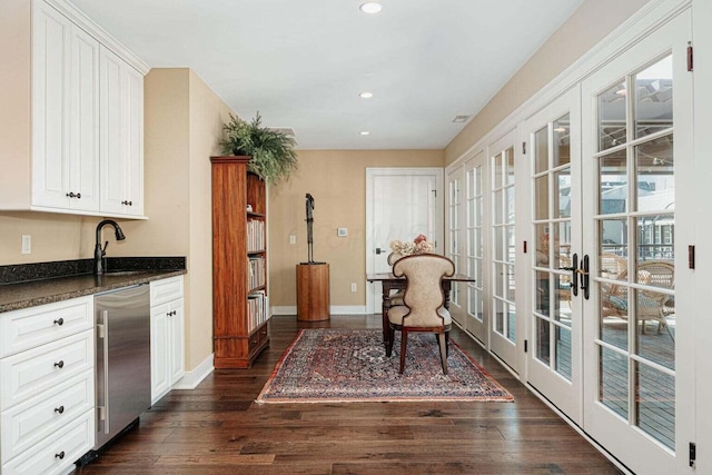 interior space with sink, dark wood-type flooring, and french doors